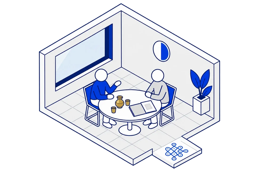 The engineer and a client talk over chai at a round table, a clock showing a short half-hour slot, a kolam at the entrance.